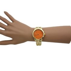 This Gold and Solid Color Face Watch from Olivia Pratt is super unique and vibrant, featuring a gold metal strap, colorful accented case, and classy numeral ticks. This watch is the perfect addition to your accessory collection. Olivia Pratt is always looking after new designs to improve your style! Using the best quality materials available in all of our products to ensure long durability in your every day wear. Please be aware, color vibrancy of the product might change from device to device. Trendy Metal Analog Watches, Trendy Gold Watches With Metal Dial, Trendy Gold Metal Watches, Orange Watches, Improve Your Style, Metal Straps, Gold Orange, Orange Gold, New Designs