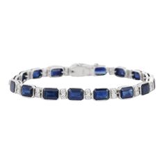 Blue Sapphire and Diamond bracelet in 18K Gold. It has a perfect octagon cut gemstone to make you stand out on any occasion or an event. A tennis bracelet is an essential piece of jewelry when it comes to your wedding day. The sleek and elegant style complements the attire beautifully, whether it's the bride wearing it herself, or as a gift to her bridesmaids to wear on the D’day.  Bracelets are worn to enhance the look. Women love to look good. It is common to see a woman rocking a lovely gold bracelet on her wrist. A gold gemstone bracelet is the ultimate statement piece for every stylish woman.  PRODUCT DETAILS :-  > Material - 18K Solid White Gold > Gemstone - Blue Sapphire  > Stone Weight - 17.85 ct > Stone Shape - Octagon  > Stone Pcs - 17  > Stone Size - 7 x 5 mm > Diamond Weight - Formal White Gold Tennis Bracelet With Rectangular Shape, Formal White Gold Rectangular Tennis Bracelet, Timeless Blue Bracelet For Formal Occasions, Elegant Emerald Cut Tennis Bracelet For Formal Occasions, Classic Emerald Cut Gemstone Bracelets, Elegant Octagon Diamond Bracelet, Classic Diamond Gemstone Bracelet For Formal Occasions, Classic Gemstone Diamond Bracelet For Formal Occasions, Classic Sapphire Gemstone Tennis Bracelet