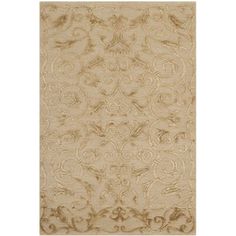 a beige rug with an intricate design on the front and back side, in neutral tones