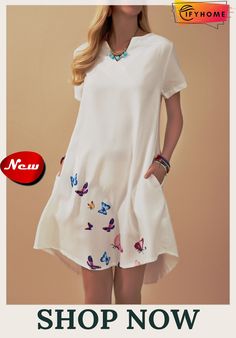 a woman in a white dress with butterflies on it and the caption shop now