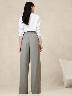 Sophisticated and decadent, this exceptionally tailored pant is crafted from our best-selling Italian stretch-wool with elegant double pleating at the front to enhance its wide-leg silhouette.  Relaxed Wide-Leg Fit: Super high waisted.  Relaxed fit from hip to thigh, voluminous leg.  Full length.  Fabric from Italy's Marzotto mill.  Internal button-tabs at the waistband adjust from high-rise to ultra-high rise.  Zip fly with hook-and-bar closure.  Belt loops.  Front and back pockets.  Unlined. Petite Shorts, Fall Capsule Wardrobe, Wool Pants, Petite Size, Siena, Trousers Women, Capsule Wardrobe, Large Size, Banana Republic