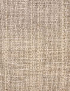 an area rug with white and beige stripes