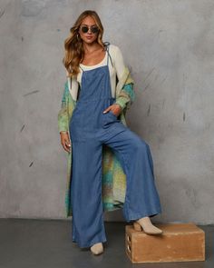 Meet the Nolah Relaxed Chambray Overall Jumpsuit—your go-to for effortlessly chic autumn style. Crafted from lightweight chambray fabric, this jumpsuit effortlessly blends Western ruggedness with Bohemian ease. Features include a practical front chest pocket and side slant pockets, plus adjustable shoulder ties for a perfect fit. Whether exploring fall foliage or lounging around, this jumpsuit offers a relaxed yet refined look that captures the essence of the season. Lightweight chambray fabric Front chest pocket and side slant pockets Adjustable shoulder ties Hidden side zipper closure Unlined 100% Lyocell Fall Jumpsuit, Jumpsuit Denim, Jumpsuit Fall, Chic Autumn, Overall Jumpsuit, Chambray Fabric, Swimwear Bottoms, Autumn Style, Dresses By Length