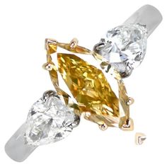 three different colored diamonds on top of each other in gold and silver ring settings with diamond accents