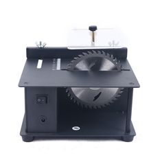 a machine that is sitting on top of a table with a circular blade in it