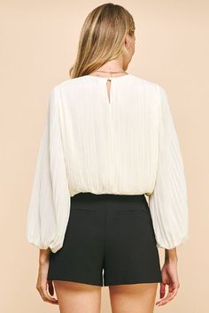 The Deserae Pleated Blouse is perfect for the office, date night or even a holiday gathering. Features an elegant bishop sleeve and gathered waist so it's easy to style and wear. Classy while being sophisticated - our favorite combination! Pleated Fabric Bishop Sleeves Gathered waistline (falls at waist) Round Neck Keyhole button back 100% Polyester Brunch Blouse With Blouson Bishop Sleeves, Blouse With Blouson Bishop Sleeves For Brunch, Bishop Sleeve Blouse With Blouson Sleeves For Brunch, Blouson Bishop Sleeve Blouse For Brunch, Brunch Blouse With Blouson Sleeves, Elegant Puff Sleeve Top With Gathered Sleeves For Brunch, Elegant Puff Sleeve Top For Brunch With Gathered Sleeves, Brunch Blouse With Balloon Sleeves, Lantern Sleeve Blouse With Gathered Sleeves For Brunch