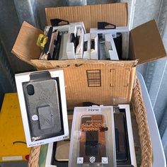 several boxes with cell phones in them sitting on top of a table next to each other