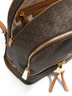 Shop brown Michael Michael Kors medium Rhea logo-print backpack with Express Delivery - Farfetch Michael Kors Backpack For On-the-go, Gold Leather Travel Backpack, Gold Luxury Backpack, Trendy Michael Kors Bag With Zipper Closure, Luxury Michael Kors Backpack With Zipper Closure, Gold Backpack With Adjustable Strap For Travel, Gold Travel Backpack With Adjustable Strap, Michael Kors Backpack With Zipper Closure For On-the-go, Designer Michael Kors Backpack With Zipper Closure