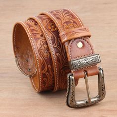 Tooled by hand from quality leather in saddle brown, this men's belt exudes Southwestern flair. Vikram Uberoi in India designs the belt, which features a leaf and flower motif and antiqued brass alloy hardware. Mens Belt, India Design, Saddle Brown, Leather Belts Men, Men's Belt, Flower Motif, Artisan Craft, Handmade Leather, Mens Belts