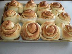 there are many rolls in the pan on the table and ready to be baked into buns