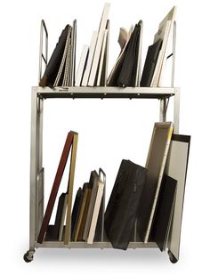 a book shelf filled with lots of books on top of metal shelves next to each other