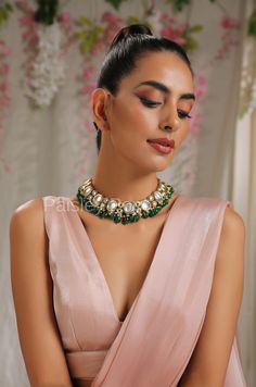 The green kundan necklace set is a classic mix of contemporary design and traditional Indian jewelry handcrafted by the artisans to celebrate a perfect romance between ancient and modern concepts. The gold-plated Kundan necklace set is a stunner neckpiece to be part of your bridal trousseau. Ace your special day by pairing this radiant necklace set with your ethnic and contemporary looks. Necklace Closure - Adjustable Dori Earrings Closure - Push Back Style Tip - This pretty necklace is sure to Green Fusion Temple Necklace For Celebrations, Green Necklace For Diwali Celebration, Green Kundan Temple Necklace For Gift, Green Fusion Kundan Necklace For Weddings, Green Fusion Style Necklace For Diwali, Green Cutdana Jewelry For Celebration, Fusion Style Green Bridal Necklace With Stone Work, Fusion Style Green Necklace For Celebration, Fusion Style Green Temple Necklace For Festive Occasions