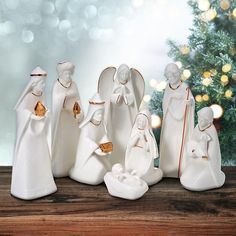 the nativity figurines are all white with gold accents