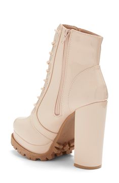 Instantly elevate any outfit with these platform booties featuring a dramatic block heel and lugged sole for trendy style. 4 5/8" heel, 1 1/4" platform 7" shaft height, 9 1/4" opening circumference Almond toe Lace-up vamp Side zip closure Covered block heel Lug platform sole PU upper/lining, plastic midsole, rubber outsole Imported Trendy Platform Boots With Lug Sole, Trendy Ankle Heeled Boots With Lug Sole, Trendy Ankle Boots With Lug Sole, Chic Spring Platform Boots With Lug Sole, Trendy Platform Boots With Lug Sole For Spring, Trendy High Heel Combat Boots With Lug Sole, Spring Trendy Combat Boots With Reinforced Heel, Trendy Spring Combat Boots With Reinforced Heel, Fall Combat Boots With Platform And Block Heel