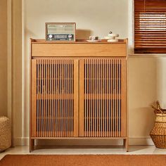 a wooden cabinet sitting in the corner of a room