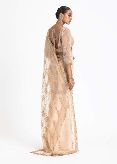 Step into the spotlight with our nude satin draped sari. This ensemble features a net-embroidered palla and blouse intricately adorned with tonal dori, highlighted with beads and crystals, adding a touch of sophistication and elegance. The nude color gives it a timeless and versatile appeal, making it suitable for various special occasions. Satin Embroidery, Desi Wedding Dresses, Net Lehenga, Drape Saree, Desi Wedding, Blouse For Women, Blouse Online, Saree With Blouse, Nude Color