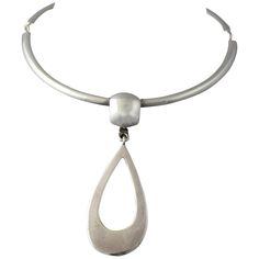 Mid 20th century choker necklace with a large open teardrop pendant by Joachim S'Paliu, the entire piece has his usual modernistic flair. I would say the necklace portion has an inside circumference of approximately 14" , the pendant is about 3.37" long. The piece is marked on the hook clasp sterling and S'Paliu and on the back of the pendant Spain. Artist information: Designer Joachim S’Paliu of Spain is a wonderful example of modernist style from the 70's. Born in 1944, the designer was at his Pendant Choker Necklace, Pendant Choker, Small Sculptures, Sterling Pendant, Funky Jewelry, Teardrop Pendant, Hook Clasp, Jewelry Inspo, Jewelry Inspiration