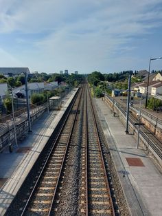 the train tracks run parallel to each other