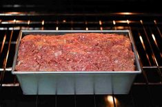 raw ground beef cooking in an oven