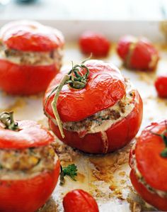 tomatoes stuffed with meat and garnished with herbs