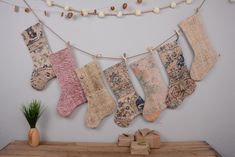 an assortment of stockings hanging on a clothes line