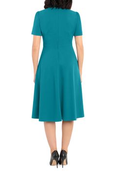 This dainty short sleeve dress is a retro inspired staple that's perfect for any well-dressed occasion. 45" length Necktie Short sleeves Back zip closure Lined 96% polyester, 4% spandex Hand wash, dry flat Imported Model Stats: 5'10" height; 34" bust; 27" waist; 35" hips. Cap Sleeve Dress With Flattering Silhouette For Work, Fitted Midi Dress With Flattering Silhouette And Short Sleeves, Fitted A-line Short Sleeve Dress For Spring, Spring Cap Sleeve Midi Dress For Work, Spring Midi Dress With Cap Sleeves For Work, Retro Fit And Flare Knee-length Dress, Fitted Cap Sleeve Midi Dress For Spring, Classic Fitted Midi Dress With Cap Sleeves, Elegant Cap Sleeve Dress With Back Zipper