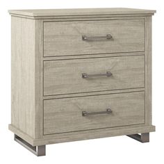 a wooden dresser with three drawers and two handles on each drawer, in grey wood