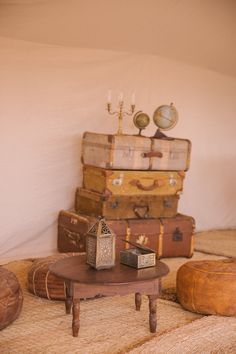 there are many pieces of luggage stacked on top of each other in this living room