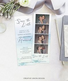 the save the date photo book is next to a bouquet of flowers and an envelope