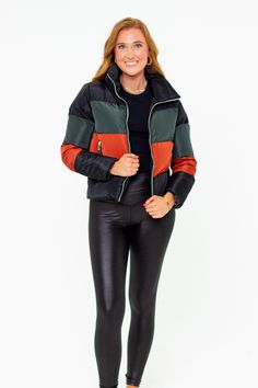 Puffer Jackets don't get more stylish than this! The Addison is the perfect addition to your winter coat collection! She features a zip up and snap closure, a color-block design, and two side pockets! Pair her with leggings, bodysuit, and sneakers for a cute on-the-go look! Product Details: Fit: The Addison Jacket fits true to size. Length: The small measures 23.5" from shoulder to hem. Bust: Accommodating to most bust sizes. Waist: Relaxed fit Fabric: ﻿Fabric does not contain stretch. Material: Winter Sporty Outerwear With Zipper Closure, Sporty Winter Outerwear With Zipper Closure, Black Nylon Puffer Jacket For Fall, Sporty Puffer Jacket For Cold Weather, Trendy Color Block Outerwear For Streetwear, Hooded Color Block Outerwear For Fall, Fall Outdoor Patchwork Puffer Jacket, Fitted Black Color Block Outerwear, Hooded Color Block Winter Outerwear