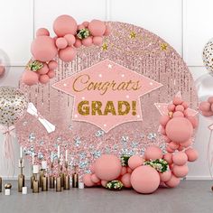 pink and gold graduation party decorations with balloons