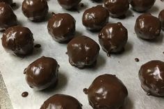 chocolate balls on a baking sheet ready to be eaten