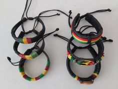 Adjustable Rasta leather bracelets with different designs. Handmade Casual Braided Bracelets, Casual Handmade Braided Bracelets As Fashion Accessory, Handmade Casual Braided Bracelet, Casual Braided Bangle Bracelets For Festivals, Casual Leather Bracelet For Beach, Casual Black Leather Bracelet For Festivals, Handmade Casual Leather Bracelet For Friendship, Casual Handmade Leather Bracelet For Friendship, Casual Brown Leather Bracelet For Festivals