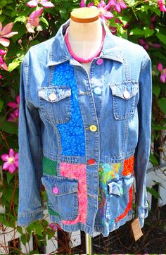 Joseph had his coat of many colors, and now you can too! This ladies large denim safari style jacket is accented with a rainbow of batik fabrics and buttons to highlight its design. You will turn heads while wearing this one-of-a-kind jacket to the football game, parties, school or work. This needs to be in your basket right now. FREE SHIPPING Multicolor Denim Outerwear With Patches, Multicolor Patchwork Long Sleeve Denim Jacket, Multicolor Patchwork Cotton Denim Jacket, Multicolor Cotton Patchwork Denim Jacket, Multicolor Denim Jacket With Patches For Spring, Multicolor Patched Denim Jacket For Spring, Spring Multicolor Outerwear With Patch Pockets, Hippie Patchwork Cotton Denim Jacket, Colorful Cotton Outerwear For Fall