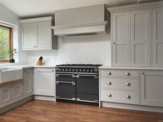 Pale grey traditional farmhouse shaker style kitchen