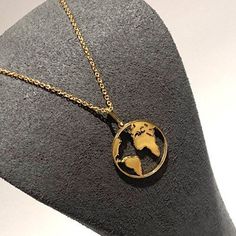 Beautiful quality, highest grade materials used,  smooth gold Globe Pendant & Necklace. Hallmarked Gold on 925 Sterling Silver. We've soldered every single section of this chain and pendant to add to its longevity and security. It has an adjustable chain which makes its totally versatile suitable for layering up with other necklaces.  A perfect gift for those loved ones that are some distance away. Metal: Gold Plated on 925 Sterling Silver ( hallmarked ) Design: World / Globe, smooth, shiny. Length of Chain: 16 - 18 inch adjustable strong beautiful chain  Pendant: Approximately 15mm length & width  Assurance: We accept returns. Good To Know: We also create this exact necklace in Silver please view our shop under the necklace section.  Don't forget to hit 'favourite' on the right so it rema Gold Stainless Steel Jewelry With Polished Finish, Gold Polished Stainless Steel Jewelry, Classic Gold Nickel-free Necklace, Matte Gold Round Jewelry With Polished Finish, Symbolic Gold Necklaces For Formal Events, Symbolic Gold Necklaces For Formal Occasions, Matte Gold Jewelry Gift, Classic Gold Stainless Steel Necklace, Gold Polished Stainless Steel Necklace