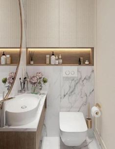 a bathroom with marble counter tops and white walls, along with a round mirror above the sink