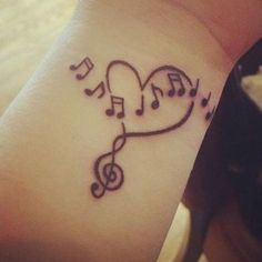 a heart with musical notes on the wrist