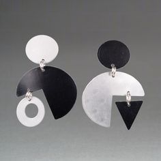 Aluminum Earrings - Name for the neutrino, an elementary sub-atomic particle, these asymmetrical, anodized aluminum earrings are articulated to swing and sway with the wearers movements. The pair is roller-printed to impart subtle texture. Surgical steel post backs. Modernist Black Earrings As Gift, Modernist Black Earrings For Gift, Modern Geometric Nickel-free Earrings, Modern Nickel-free Geometric Earrings, Diy Soda, Anodized Aluminum Jewelry, Aluminum Earrings, Black And White Earrings, Aluminum Jewelry