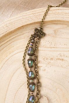 Mindfully crafted, this necklace from the Crisp Autumn collection offers a stylish and eye-catching way to accessorize. Perfect for pairing with other pieces from the line. Antique Brass (lead and nickel free) Crystal 32-34", adjustable with antique brass lobster claw clasp We hand select our natural materials, thus there may be slight variations in color and/or size that will not detract from the overall aesthetic Our unique handcrafted designer jewelry for women is made in America, with each d Autumn Jewelry Aesthetic, Antique Gold Adjustable Jewelry For Vintage Collection, Adjustable Bronze Jewelry With Lobster Clasp, Adjustable Bronze Chain Jewelry, Elegant Antique Finish Adjustable Necklace, Antique Gold Brass Jewelry With Lobster Clasp, Adjustable Multi-strand Brass Jewelry, Bronze Brass Jewelry With Beaded Chain, Bronze Brass Beaded Chain Jewelry