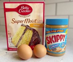 ingredients for cake sitting on top of a counter next to a package of frosting