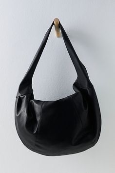 Carry it all in this so cool bag featured in a slouchy, crescent-style silhouette and stunning vegan leather fabrication to add a luxe touch to any look. **Features:** Oversized design, crescent style, vegan leather fabrication, fully lined interior, zip top closure, interior pocket **Why We ❤ It:** Just as cool as it is classic, this goes-with-anything bag is sure to be a staple in your accessories collection for many years to come. | Slouchy Carryall Bag by FP Collection at Free People in Blac Crescent Shoulder Bag, Black Slouchy Bag, Slouchy Shoulder Bag, Free People Bag, Grunge Tote Bag, Leather Slouch Bag, Oversized Shoulder Bag, Slouchy Tote Bag, Black Hobo Bag