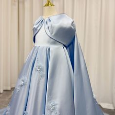 Dazzle all eyes with our DreamyVow Luxury Blue Dubai Girl Dress. Stunning beaded crystal and elegant Arabic style make it perfect for weddings, birthdays, and special occasions. Feel like royalty in this princess-inspired ball gown, sure to make any little girl's dreams come true. Blue Princess Dress With Fitted Bodice, Blue Ball Gown Princess Dress For Debutante Ball, Princess Style First Communion Dress For Pageant, Blue Princess Dress For Debutante Ball, Elegant Blue Princess Dress For Pageant, Princess Ball Gown For Pageant And Prom Season, Blue Princess Dress With Fitted Bodice For Debutante Ball, Elegant Light Blue Princess Dress For Pageant, Blue Ball Gown With Fitted Bodice For Pageant