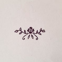 a black and white photo of a flower design on a sheet of paper that has been stenciled