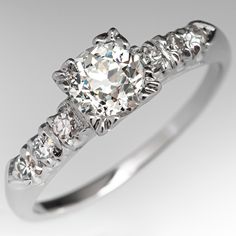 a diamond ring with five stones on it