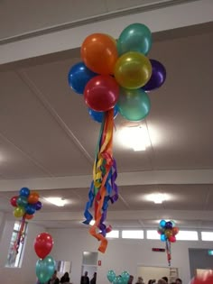 balloons and streamers are hanging from the ceiling