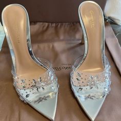 Gianvito Rossi Silver Halley 105 Heeled Mules! Never Worn, Brand New, With Box, And Dust Bag. Excellent Condition. Never Worn. Size 35.5 - Open Pointed Toe - Heel: H4in - Leather Sole -Transparent Vinyl Luxury Rhinestone Heels For Spring, Luxury Embellished Pointed Toe Heels, Luxury Crystal Embellished Heels For Spring, Designer Pointed Toe Wedding Shoes, Elegant Clear Heels With Heel Strap, Elegant Clear Heels With Open Heel, Clear Heels With Heel Strap For Party, Party Heels With Heel Strap In Clear Color, Party Clear Heels With Heel Strap