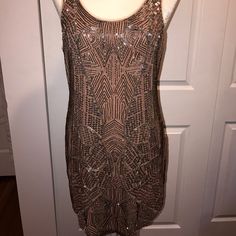 Urban Outfitters Ecote Beaded Mini Dress. Fitted Silhouette Cut Short With Beautiful Beaded Embellishments. There Are 2 Spots Where There's Pulling/Loss Of Beads, But Not Noticeable At All. A Pretty Mauve/Pinkish Color With Silver, Gray And Copper Colored Beads. Perfect For New Years, Fancy Wedding/Party,Etc. Form Is A Size 6 And It Fits Perfectly. Never Worn, Nwt. Extra Beads, Etc Still Attached! Sleeveless Embellished Sequin Dress For Party, Champagne Sleeveless Sequin Dress, Glamorous Beaded Sleeveless Mini Dress, Holiday Champagne Embellished Sequin Dress, Beaded Sleeveless Sequin Dress For Formal Occasions, Sleeveless Beaded Sequin Dress For Formal Occasions, Formal Sleeveless Sequin Dress With Beads, Urban Outfitters Sleeveless Mini Dress For Party, Formal Sleeveless Beaded Sequin Dress