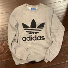 Women’s Size Xsmall Grey Adidas Logo Crew Neck Sweater. Very Comfy And Perfect With Leggings. New, Never Worn. Purchased From Adidas Store. Adidas Logo Cotton Crew Neck Sweatshirt, Adidas Logo Sweatshirt With Crew Neck For Fall, Adidas Athleisure Sweatshirt With Letter Print, Adidas Logo Print Tops For Fall, Adidas Casual Sweatshirt For Fall, Adidas Long Sleeve Top With Logo Print, Fall Adidas Tops, Adidas Sporty Tops For Loungewear, Sporty Adidas Tops For Loungewear