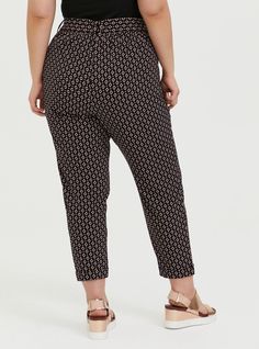 This lightweight pant has a sleek tapered leg while an optional self-tie sash adds a little playful personality. Crepe fabric. Front pockets. Removable self-tie sash. Tapered leg; rolled cuff. Pull-on design. CONTENT + CAREPolyester/spandex. Wash cold; dry low. Imported plus size pants. SIZE + FITModel is 5'8”, size 1. 27” inseam. The best plus size women's pull-on taper stretch crepe high-rise tie-front pant skinny & tapered pants in geo black made of studiocrepe. Torrid is your destination for Relaxed Fit Tapered Leg Bottoms With Tie Waist, Chic Tapered Leg Pants With Tie Waist, Relaxed Fit Tapered Leg Pants With Tie Waist, Chic Paperbag Waist Bottoms For Loungewear, Peach Crepes, Tapered Pant, Paperbag Pants, Cropped Joggers, Lightweight Pants